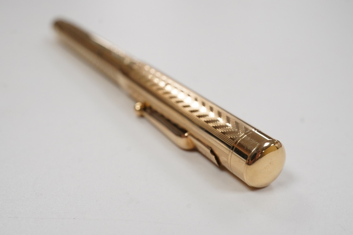 A Mabie Todd & Co. Swan gold filled twist filler, Made in England with No.2 14ct. flexible nib